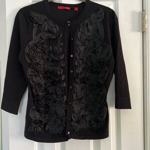 Women’s Black Cardigan by CYRUS.Sz-M. Never worn.Button front with rosettes.
